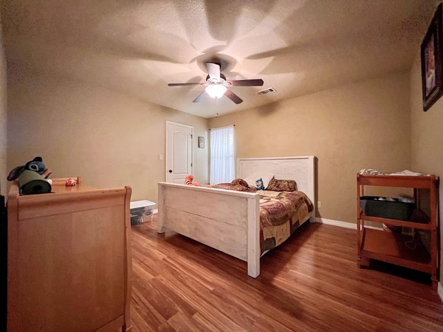 3717 S County Rd 1314, Odessa, TX 79765 - bedroom with wood finished floors, baseboards, and ceiling fan
