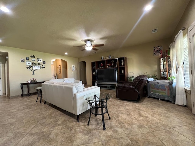 3717 S County Rd 1314, Odessa, TX 79765 - living room featuring ceiling fan, arched walkways, recessed lighting, and a textured ceiling
