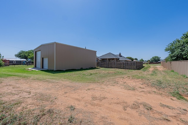 10901 E County Rd 108, Midland, TX 79706 - view of yard with a garage and an outbuilding