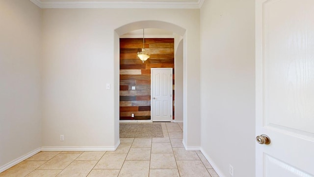 10901 E County Rd 108, Midland, TX 79706 - hallway with arched walkways, wooden walls, light tile patterned floors, baseboards, and crown molding