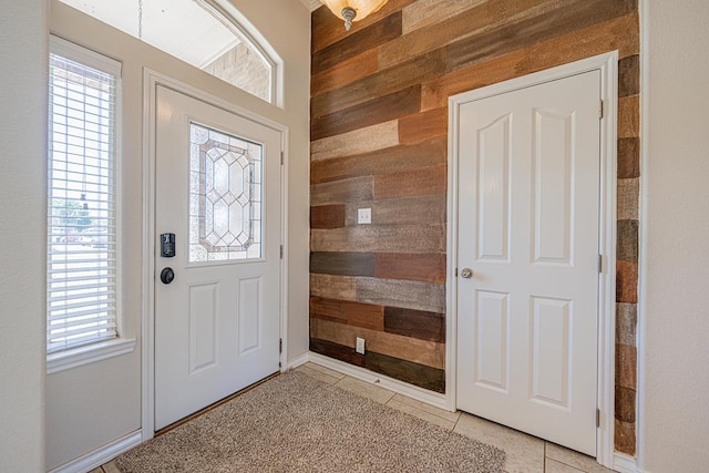 10901 E County Rd 108, Midland, TX 79706 - foyer with wood walls and light tile patterned floors