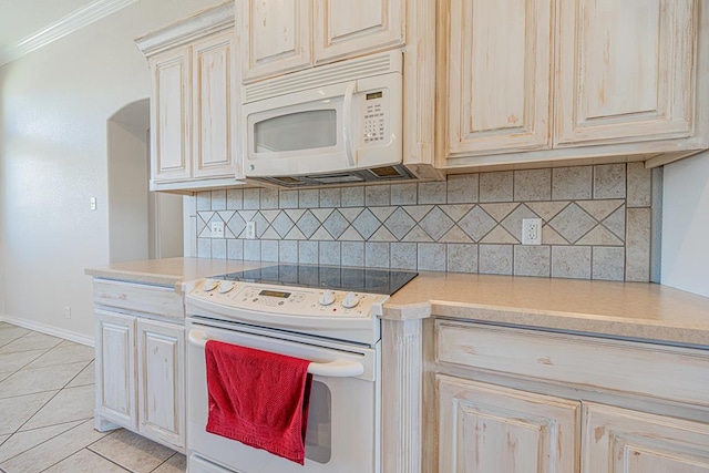 10901 E County Rd 108, Midland, TX 79706 - kitchen with white appliances, light countertops, tasteful backsplash, crown molding, and light tile patterned floors