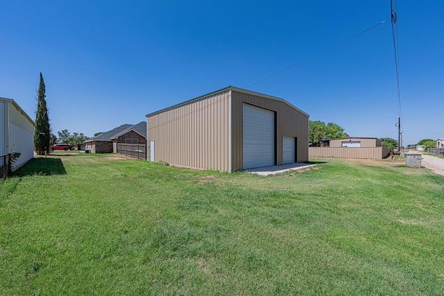 10901 E County Rd 108, Midland, TX 79706 - view of yard featuring a garage and an outbuilding