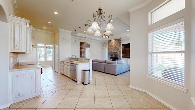 10901 E County Rd 108, Midland, TX 79706 - kitchen featuring dishwasher, light countertops, light tile patterned flooring, a chandelier, and crown molding