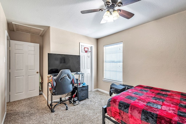 9540 W April St, Odessa, TX 79764 - bedroom with light carpet, a textured ceiling, ceiling fan, attic access, and baseboards