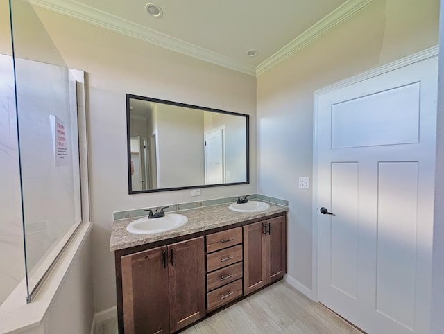 9 Prairie View Ln, Alpine, TX 79830 - bathroom with double vanity, ornamental molding, and wood finished floors