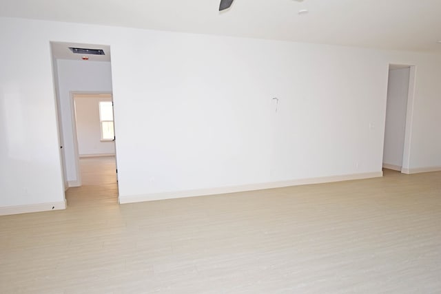 8639 Fortuna Ct, Odessa, TX 79765 - spare room featuring light wood-style floors, a ceiling fan, and baseboards