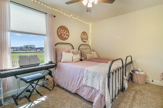 bedroom featuring ceiling fan and light colored carpet