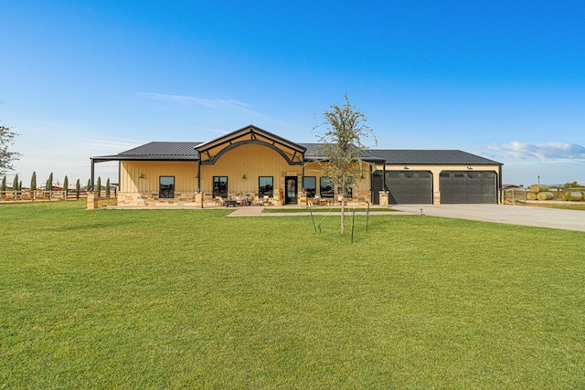 exterior space featuring a garage and a front lawn