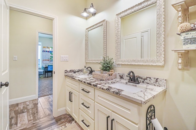 bathroom featuring wood-type flooring and vanity