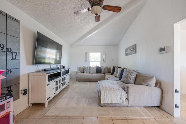 living area with ceiling fan, lofted ceiling, a textured ceiling, light tile patterned flooring, and baseboards