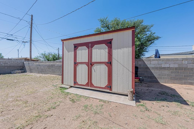 view of shed featuring a fenced backyard