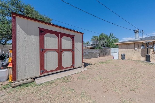 view of shed featuring a fenced backyard