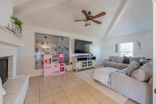 living room with a textured ceiling, a ceiling fan, light tile patterned flooring, a fireplace, and baseboards
