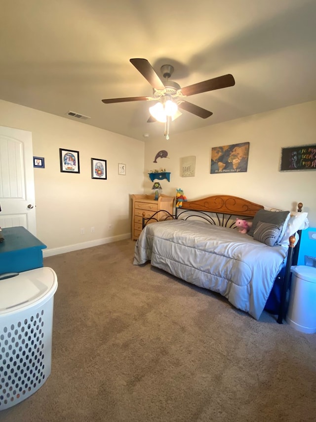 808 Brittlebush Ct, Odessa, TX 79765 - bedroom with carpet floors, a ceiling fan, and baseboards