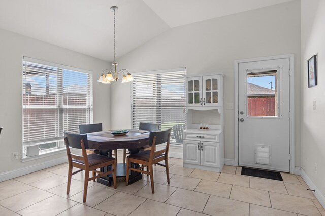 808 Brittlebush Ct, Odessa, TX 79765 - kitchen with appliances with stainless steel finishes, a sink, vaulted ceiling, dark stone countertops, and light tile patterned flooring