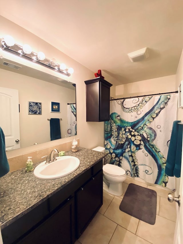 808 Brittlebush Ct, Odessa, TX 79765 - bathroom with tile patterned floors, vanity, toilet, and a shower with curtain