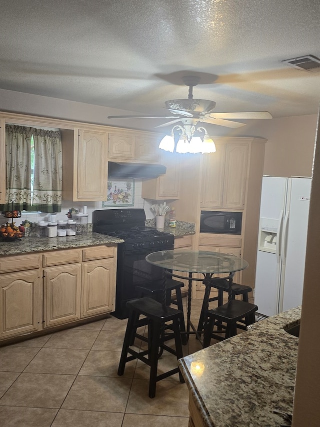 2301 Stoner Rd, Odessa, TX 79764 - kitchen featuring black appliances, ceiling fan, range hood, light brown cabinets, and a textured ceiling