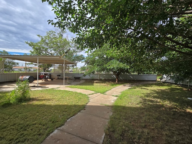 2301 Stoner Rd, Odessa, TX 79764 - fenced backyard with a patio area