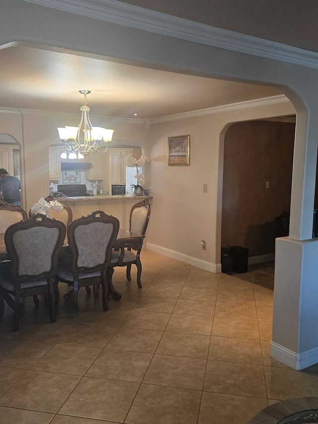 2301 Stoner Rd, Odessa, TX 79764 - dining area featuring arched walkways, a chandelier, ornamental molding, and light tile patterned floors