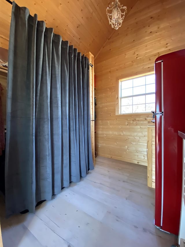 102 Low Meadow Pt, Fort Davis, TX 79734 - miscellaneous room with vaulted ceiling, wooden walls, a chandelier, wood finished floors, and wood ceiling