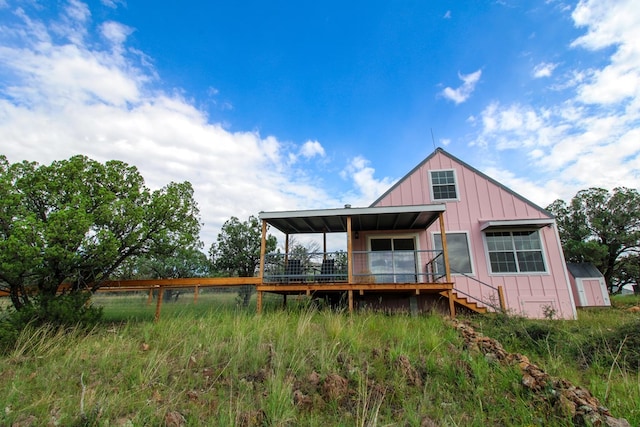 102 Low Meadow Pt, Fort Davis, TX 79734 - back of property featuring board and batten siding and a wooden deck