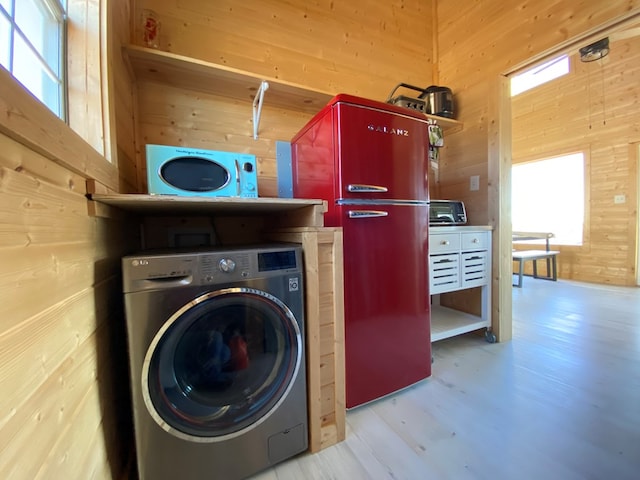 102 Low Meadow Pt, Fort Davis, TX 79734 - laundry room featuring washer / dryer, wooden walls, and wood finished floors