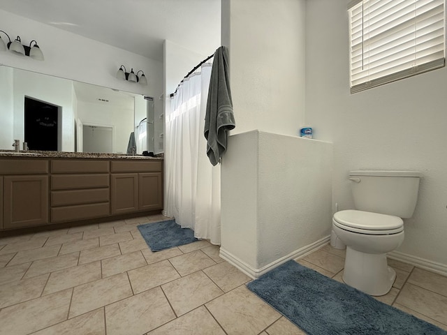 full bath featuring a sink, tile patterned flooring, double vanity, toilet, and a shower with curtain