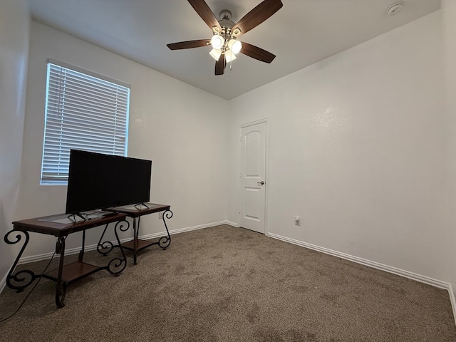 interior space with baseboards and ceiling fan
