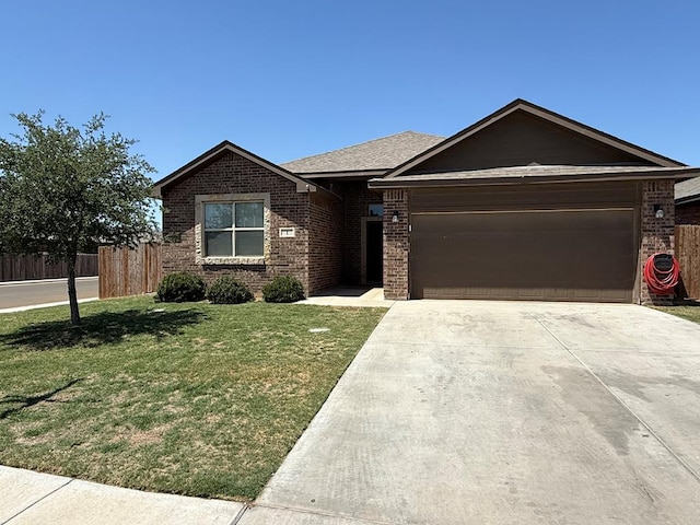 single story home featuring a garage, a front yard, driveway, and brick siding