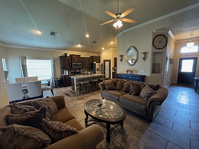 6981 King Ranch Rd, Odessa, TX 79765 - living area with ornamental molding, a ceiling fan, vaulted ceiling, and recessed lighting