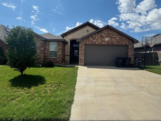 6981 King Ranch Rd, Odessa, TX 79765 - view of front of home featuring brick siding, an attached garage, and concrete driveway
