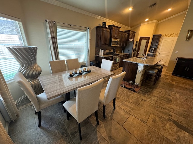 6981 King Ranch Rd, Odessa, TX 79765 - dining area featuring crown molding, recessed lighting, and stone tile floors