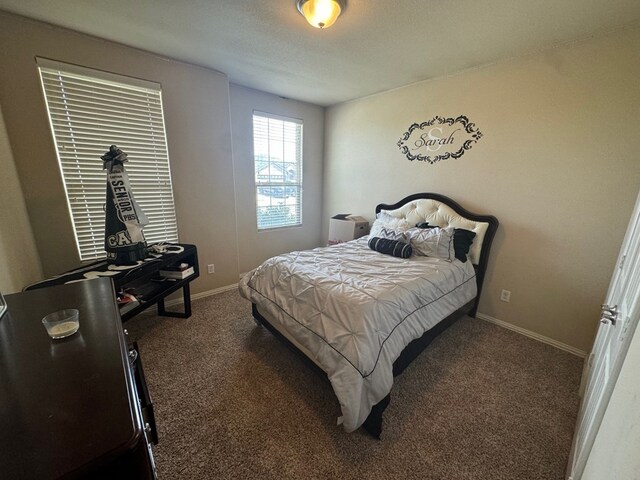6981 King Ranch Rd, Odessa, TX 79765 - bedroom featuring carpet flooring and baseboards