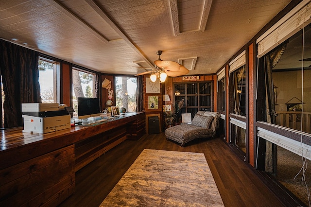 interior space with wood ceiling, ceiling fan, dark hardwood / wood-style flooring, and a healthy amount of sunlight