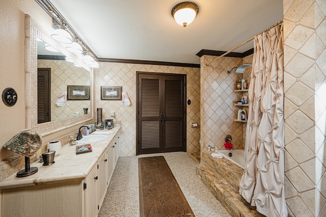 bathroom with shower / bath combo with shower curtain, vanity, and crown molding