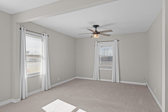 carpeted empty room featuring ceiling fan