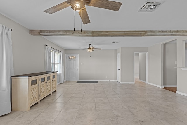 unfurnished living room with beam ceiling and ceiling fan