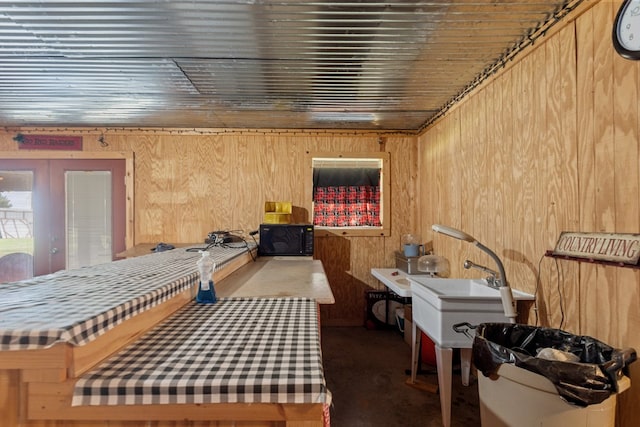 4975 SE 3000, Andrews, TX 79714 - misc room featuring wooden walls and french doors