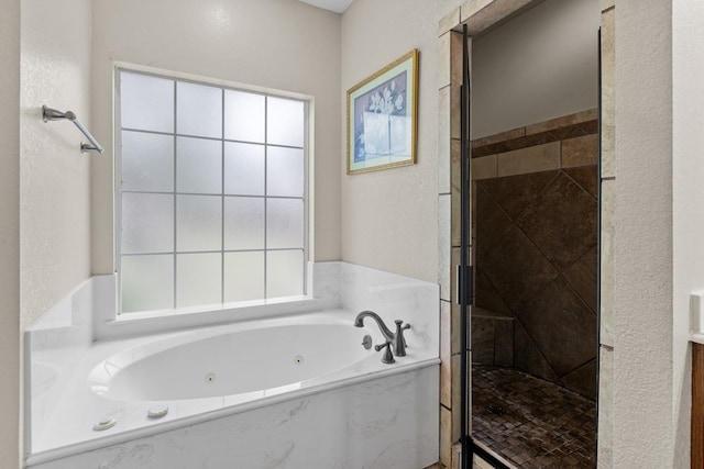 4975 SE 3000, Andrews, TX 79714 - full bathroom featuring a jetted tub and a shower stall