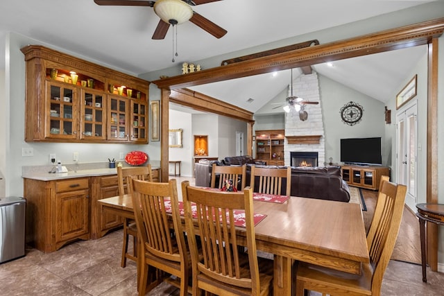 4975 SE 3000, Andrews, TX 79714 - dining room with ceiling fan and a fireplace