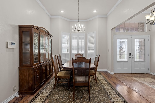 4975 SE 3000, Andrews, TX 79714 - dining room featuring a chandelier, wood finished floors, ornamental molding, recessed lighting, and french doors