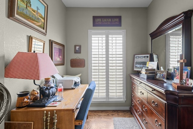 4975 SE 3000, Andrews, TX 79714 - office area featuring plenty of natural light and wood finished floors