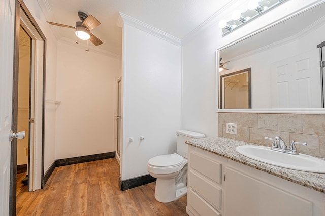 bathroom with vanity, ornamental molding, wood-type flooring, and walk in shower