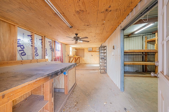 basement with ceiling fan and wood ceiling