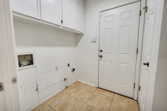 washroom featuring electric dryer hookup, hookup for a washing machine, cabinets, and light tile patterned flooring