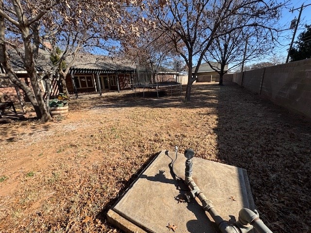 view of yard featuring a trampoline