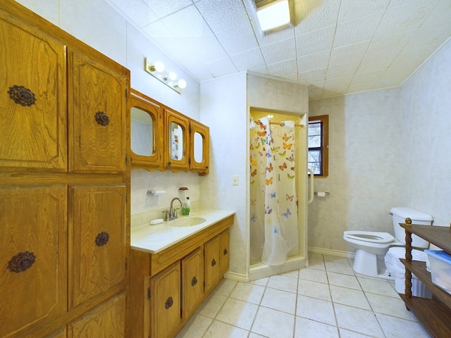 bathroom with a shower with shower curtain, vanity, toilet, and tile patterned floors