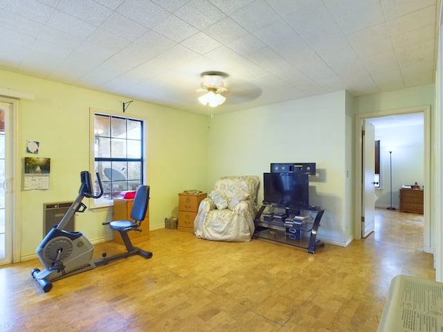 exercise room with ceiling fan