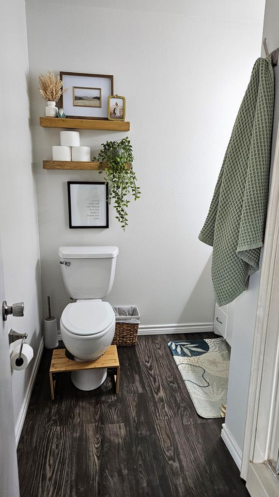 bathroom featuring hardwood / wood-style floors and toilet